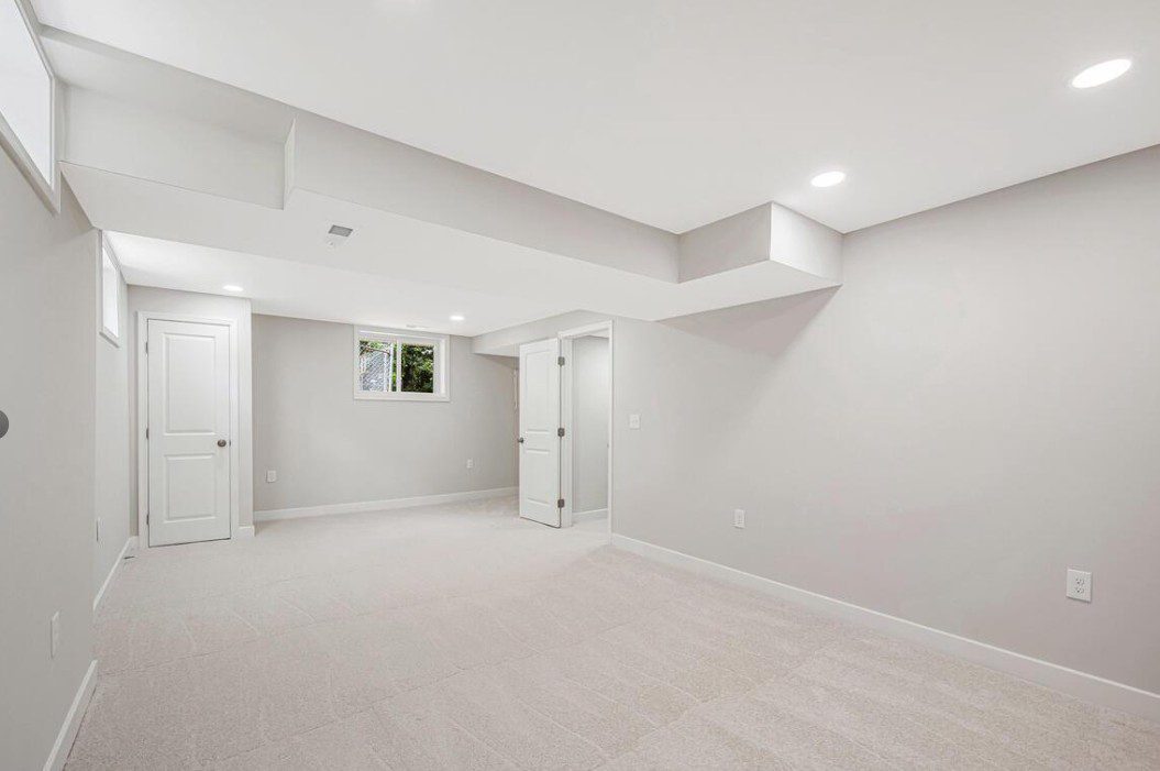 Finished basement with carpet and recessed lighting