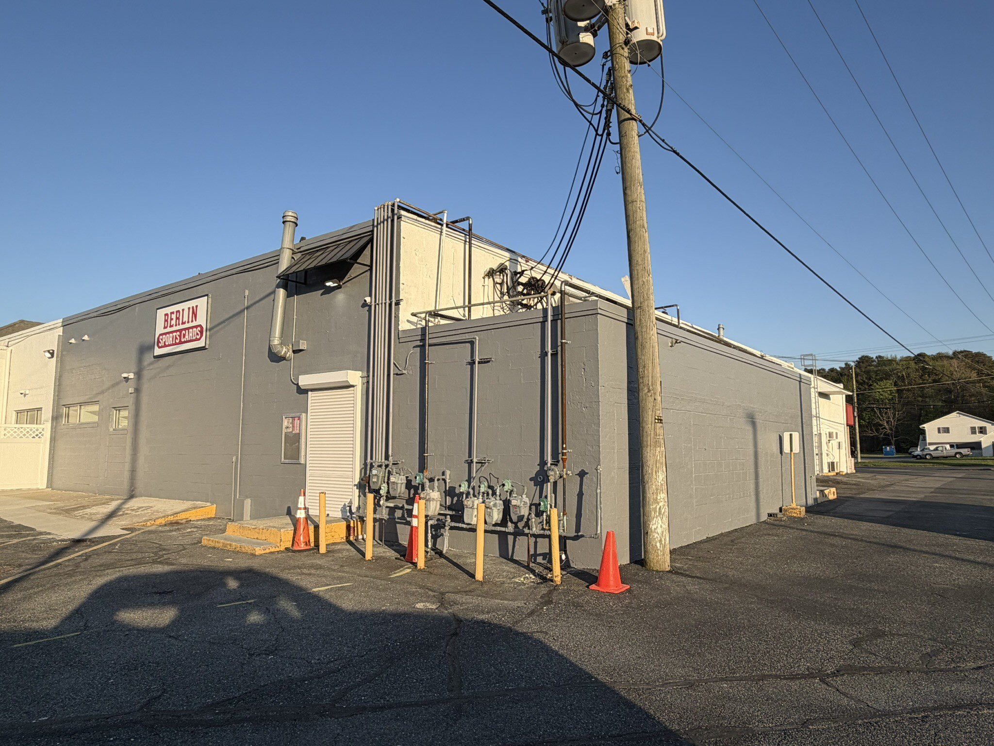 Gray commercial building with utility meters